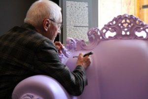Alessandro Mendini signs one of his Proust Armchair.
