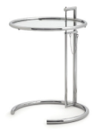 Table e1027:一张带玻璃台面的金属桌。