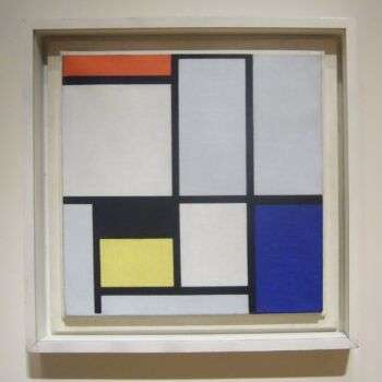 Piet Mondrian Composition C (No.III) with Red, Yellow and Blue: a painting with blue, orange, yellow and white rectangles outlined in black.