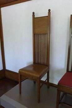 Robie House Chair (1908)- Frank Lloyd Wright Chair: A brown, wooden chair.